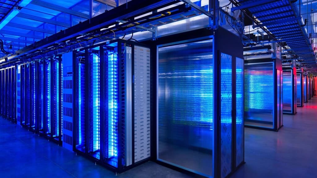 Rows of server racks lit in blue